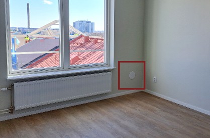 Bild på vägguttag för utblåsslangen