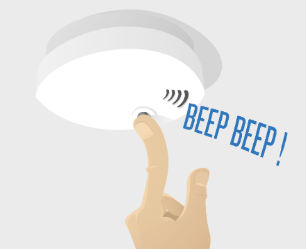 en brandvarnare och ett finger som ska trycka på knappen